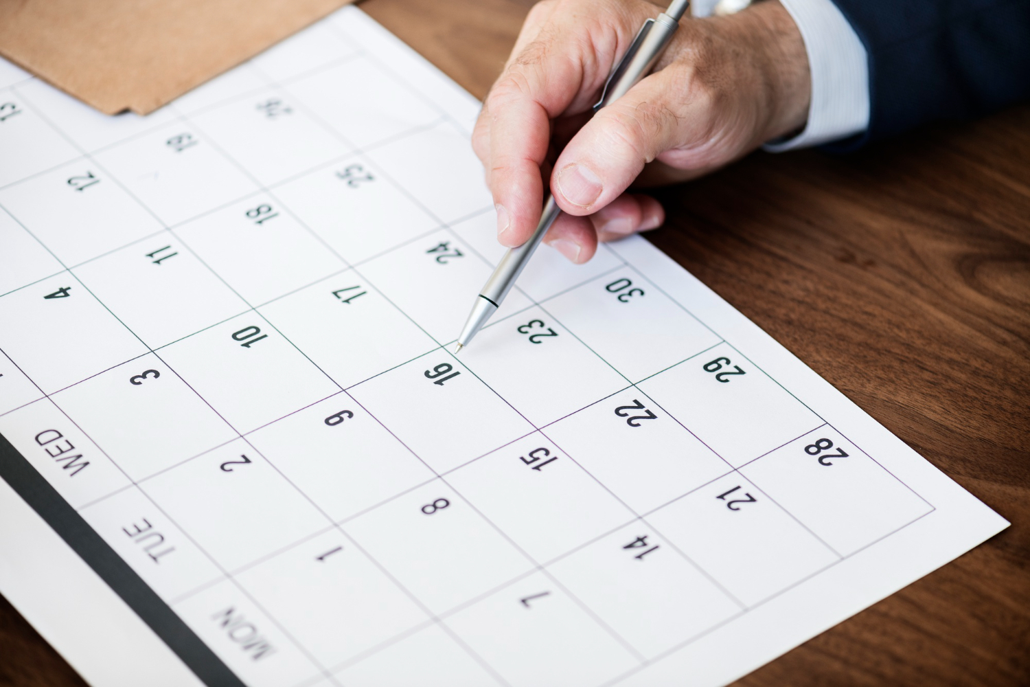 businessman marking calendar appointment